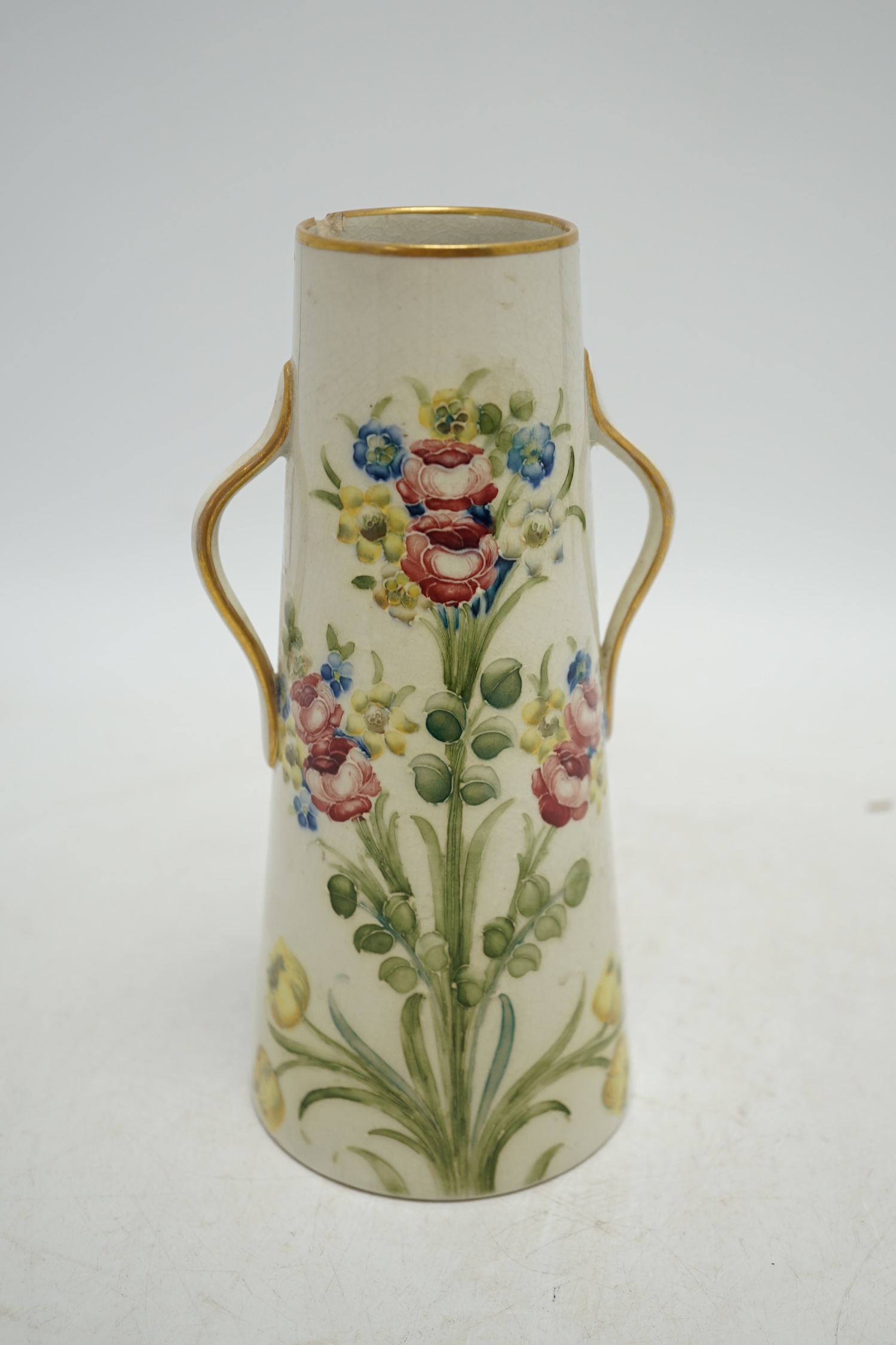 A Moorcroft for McIntyre Florian Ware two handled vase, circa 1905, height 20cm. Condition - large chip and crack to top rim